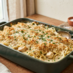 creamy pasta and chicken in a forest green