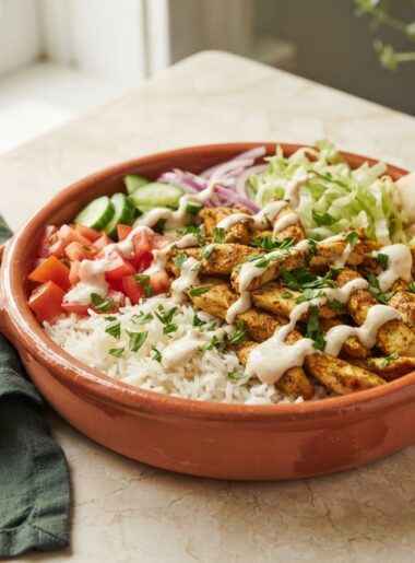 Chicken Shawarma Bowls with Garlic Sauce - golden spiced chicken over rice with fresh vegetables and creamy sauce
